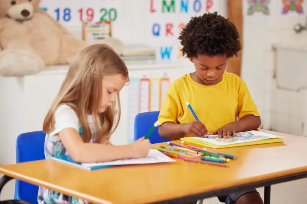 School, children and coloring on paper in classroom for creative activity, learning development or art lesson.